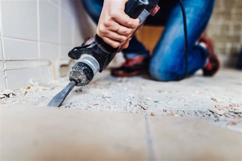 Remove tile floor. This process of removing tile floor is actually pretty similar to removing tile backsplash. When you are removing tile floor, the first tile is the hardest. If you aren’t demoing the entire bathroom like us, it helps to remove even just a small section of baseboards so that you can see an edge of the tile floor. If … 