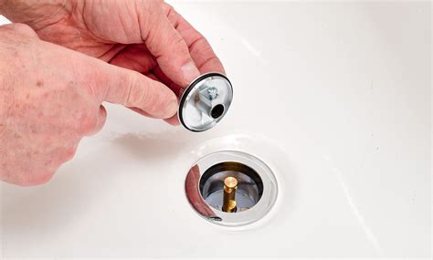 Remove tub stopper. To remove a pop-up bathtub stopper: Flip the lever to the open position to access the plug and rocker arm assembly. Use your fingers or a set of pliers to squeeze the sides of the drain stopper ... 