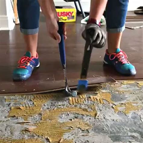 Removing adhesive from engineered wood flooring