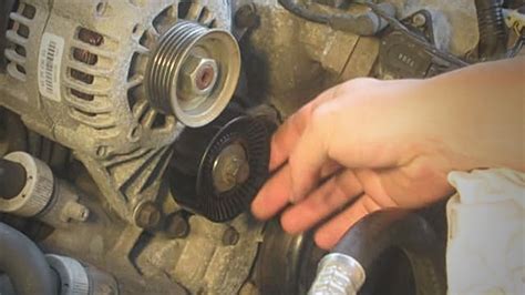 When installing the new tensioner, torque the bolts to 24 Nm (17.7 lb-ft). If you don’t plan on working on the main belt system, reverse the steps now to put the car back together. 8. Turn the tensioner pulley bolt CW to de-tension the main belt, and remove the belt.. 