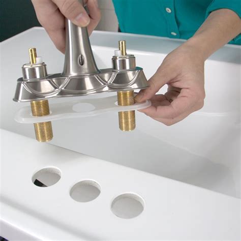 Replace bathroom sink faucet. 6. Put your faucet back together. Put the retainer nut or clip back on to secure the new cartridge or disk in place. Then, set your handle back on top of the faucet and tighten the set screw to secure it. Push the decorative cap back onto the handle until it snaps into position. 