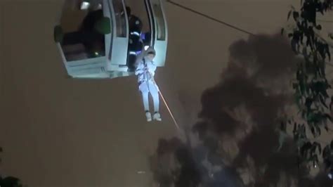 Rescuers free dozens trapped on one of world’s highest cable car systems