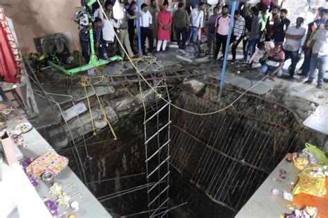 Rescuers working overnight have found 35 bodies after well structure collapsed at  Hindu festival in central India