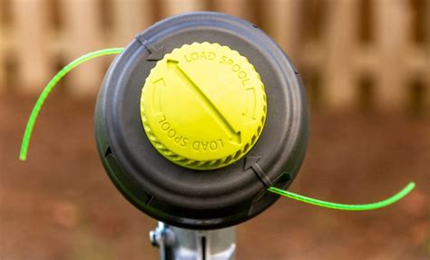 Restringing ryobi expand it trimmer. Line up the arrows, feed the line threw so that it's even, then wind it! 