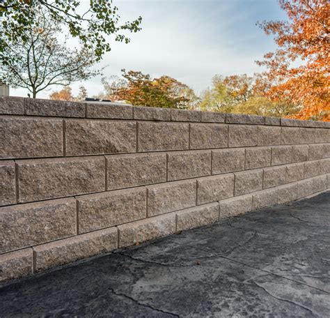 Retaining wall base installation - Allan Block Wall Systems