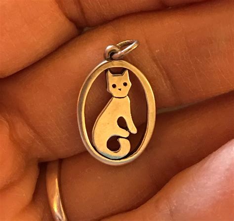 Retired james avery cat charm. James Avery 925 Angel Fish Pendant/Brooch on 925 Chain. (332) $699.00. James Avery Retired Tree of Life. Brass & Sterling Silver. (440) FREE shipping. $390.00. 