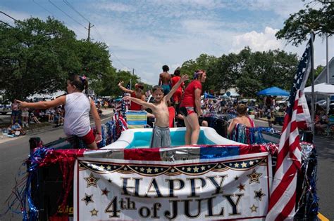 Revelers across the US brave heat and rain to celebrate Fourth of July, but some events delayed