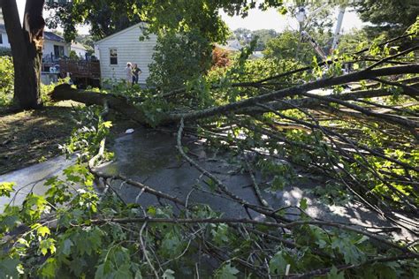 Rhode Island tornado lifts car as New England storms damages homes, flood roads
