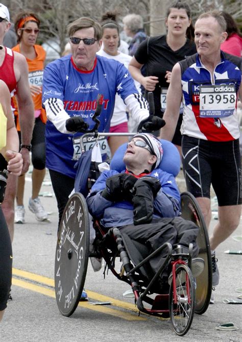 Rick Hoyt, who became a Boston Marathon fixture with father pushing wheelchair, has died at 61