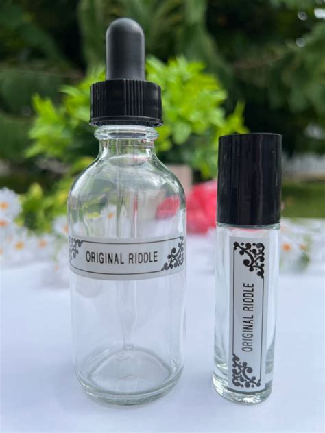 Riddle perfume oil. 1,297 Reviews. $ 40.00. Shipping calculated at checkout. Quantity. Add to cart. Find your new Riddle signature scent by trying out all seven scents. Sample kit includes 7 x 1ml roll-on bottles. This kit also comes with $10 to use towards a full-size bottle (an email will be sent to you with your unique code after your order has been fulfilled). 