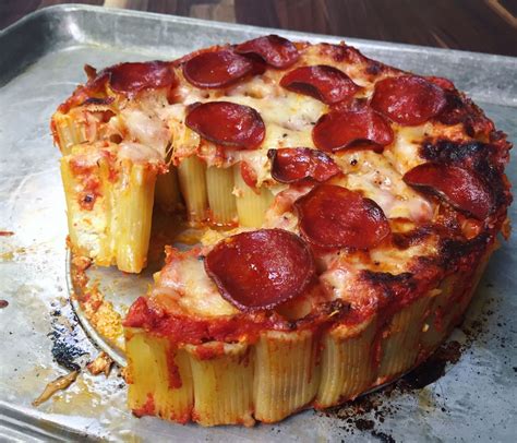 Rigatoni pizza. Simmer until heated through and the cheese has melted. Make the pasta. Cook pasta in a large pot of salted, boiling water until al dente while the sauce is simmering. Reserve 1 cup of pasta water before draining the pasta. Combine pasta & sauce. Add cooked pasta to the finished sauce and stir to combine. 