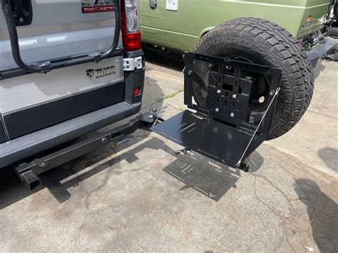 Tire carrier primary swing arm. Take the 2 2×3 box tube ends cut at 8 degrees and line them up to create a 16 degree angle. This will form the primary swing arm. Tack these together. Take the swing out spindle sleeve and trace the round OD onto the short side, grind this arc out and tack the sleeve on.. 