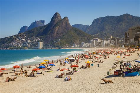 Rio de janeiro brazil beaches. Leblon Beach is one of the main beaches in Rio de Janeiro, Brazil. It's summer in Brazil and the beaches are getting busier.It's summer in Brazil and the bea... 