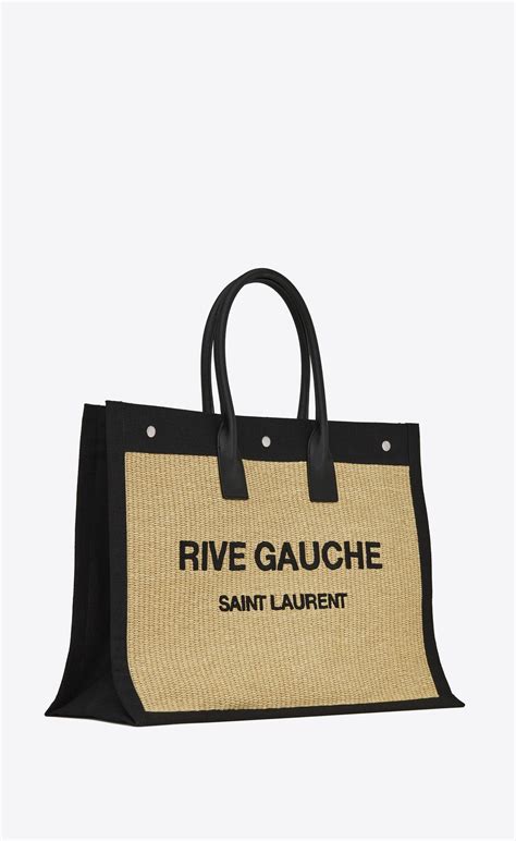 Rive gauche ysl bag. LARGE CANVAS TOTE BAG IN LINEN AND LEATHER EMBLAZONED WITH ‘RIVE GAUCHE’. SPACIOUS EAST/WEST FORMAT, WITH 3 MAGNETIC SNAP TABS and LEATHER handles. LIGHT BRONZE METAL hardware. ONE interior zipped POCKET. DIMENSIONS: 18.8 x 14.1 x 6.2 INCHES. 