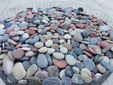 River rock for sale near me. Most river rock is sold by the super-sack (appx. 3,000 lbs./appx. one cubic yard +/-), or in 5-gallon buckets for smaller projects. A super-sack may cover 80 - 150 sq. ft., depending on the size of the rock. Kansas river rock may be available loose in a skid steer scoop (appx. one ton). All sizes of rock are approximate sizes. 