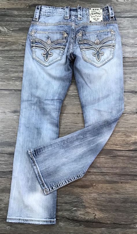 distressed alt-straight fit jean with silver hardware features beige thread 'rr' & 'fleur de lis' patch embroidery hand whiskers & signature 'rr' emblem patch on waistband designed in …. 