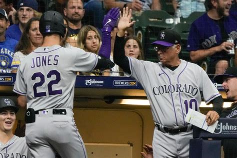 Rockies walk to a bizarre, 7-3, 10-inning win over Brewers
