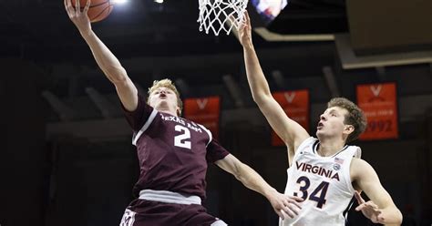 Rohde scores 13, Virginia clamps down on D to beat No. 14 Texas A&M 59-47