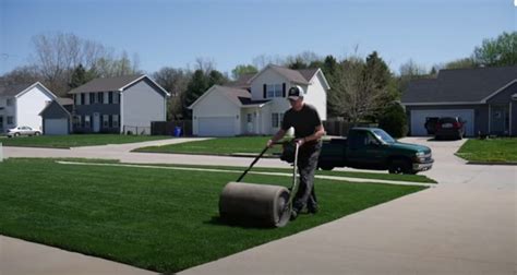 Roll the yard. Using a straight edge in your yard, unroll the first row of sod. Try following the line of your patio, driveway or fence to keep the edges straight and even. Rake the soil as you lay the sod to clear any bumps under the surface. After you’ve laid the first row, smooth out any … 