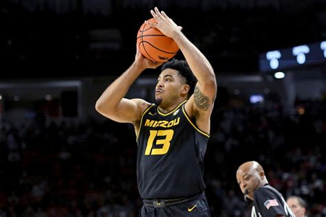 Mizzou marches on at SEC tourney, takes down Ole Miss. Missouri forward Ronnie DeGray III (21) celebrates after making a three-point basket during the first half of an NCAA men's college .... 