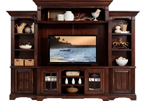 Our custom home entertainment centers offer plenty of cabinet space, drawers, and shelving for all your media center needs. Built-in cabinets offer smart storage options for CDs, DVDs, and games, while also offering opportunities to conceal unsightly speakers. Your designer can recommend several freestanding or built-in styles in rich wood ....