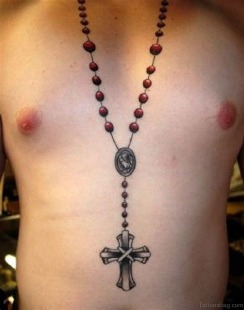 Rosary tattoos on chest. Tattooed across the chest, the rosary could symbolize protection of the heart and desires. This could work very well for anyone who wants to show that their religion is what they hold closest to their hearts. To make a rosary tattoo work in this area, many people will wrap the beads around their heart areas and have the crucifix drape downward. 
