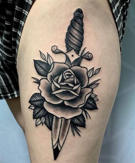 Rose and dagger tattoo. The rose and dagger tattoo is a popular design that has been around for centuries. It is a symbol of beauty and danger, reflecting the duality of life. In this article, we will explore the history and origins of this tattoo design, as … 