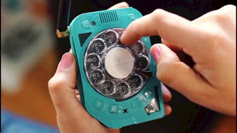 Rotary cell phone. The phone has a rotary dial for selecting numbers and making calls, a satisfyingly chunky power button, a big red cancel switch, a memory function, micro-display and oddly enough, a built-in radio ... 