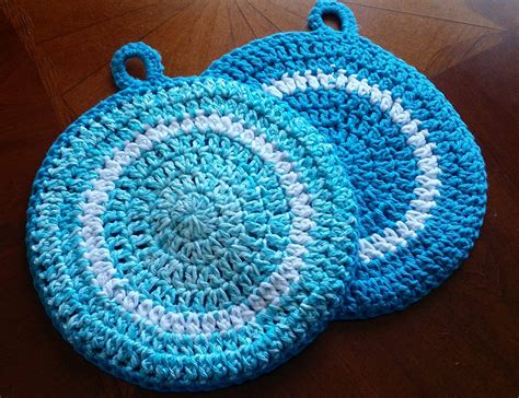 Round crochet potholder pattern. GINGHAM PLAID CROCHET POTHOLDERS PATTERN: With C1, chain 29. Row 1: (C1) Sc in 2nd chain from hook and across, finish last stitch with C2 – 28 sc. ... Round 1: Turn ... 