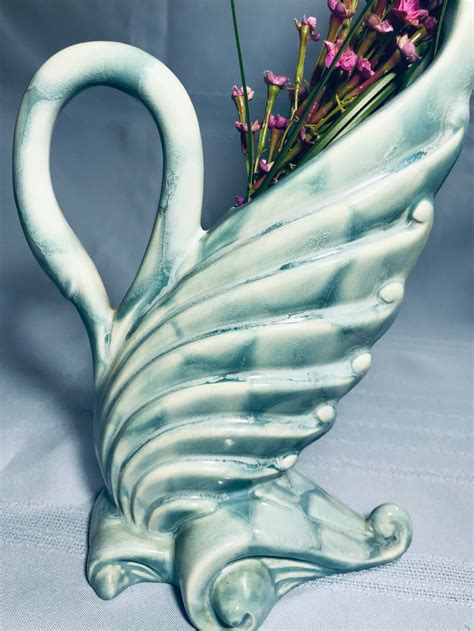 Vintage Royal Haeger By Royal Hickman, R430 USA Aqua Sitting Swan Vase, Art Pottery, Pottery Connoisseur, Circa 1940s. Royal Hickman designed pottery, glass, silver, aluminum, furniture, and lamps. From 1938-1944 and again from the 1950s to 1969 he worked for Haeger Potteries. While living in. 