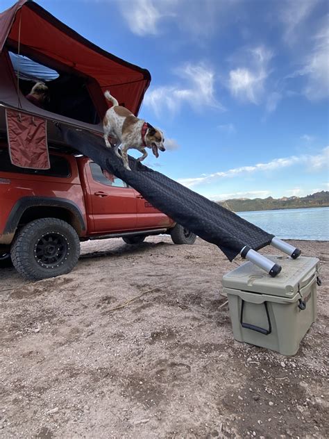 Safely and easily get your Pups into your cab height mounted Rooftop Tent thanks to the DOGGO RTT Ramp™ PRO! Our new design gives your dog at least a 31.5° angle, even if your tent is mounted 8ft high. This is significantly less of an angle than your average 45° staircase. It includes a 12ft telescoping ladder and our utility patented ramp.. 
