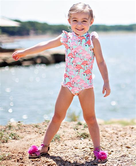 Rufflebutts. Little girls just look so adorable in seersucker! This sweet long sleeve girls' rash guard and bikini set is the go-to suit for vacations and trips to the beach. The full coverage style and UPF 50+ fabric will keep her safe from the sun's harmful rays. Add a personalized and traditional touch with a monogram! *Ruffle hem layers slightly over the waist of the swim … 