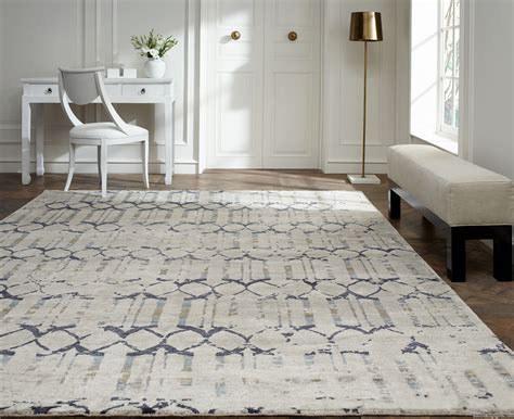 Rug company. Our Platinum rug designed by David Rockwell, is handknotted in a tactile blend of Tibetan wool and silk. The luxurious colour palette of shimmering metallic tones complements the graphic, textural design, lending it a glamorous edge. Price Band: 9. Craftsmanship: Handknotted Tibetan wool and silk. Knot count: 100 knot. 