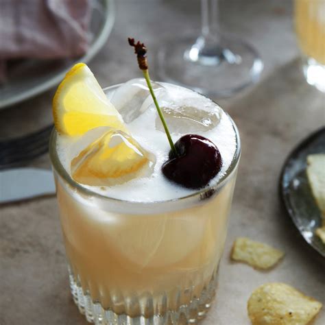 Rum sour. Shake: Combine 2 oz bourbon, 1 oz lemon juice and ¾ to 1 oz simple syrup in a cocktail shaker and shake until cold. Strain it into a glass. Make the red wine layer: Hold the back of a spoon right above the top of the glass. Then gently pour the red wine on top of the spoon into the glass. 