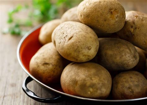 When planting russet potatoes, aim for a planting depth of around 3 to 4 inches. Space the seed potato pieces approximately 12 to 15 inches apart within rows, with rows spaced 2 to 3 feet apart. Planting in hills or ridges can also help improve drainage and prevent waterlogging around the developing plants.. 