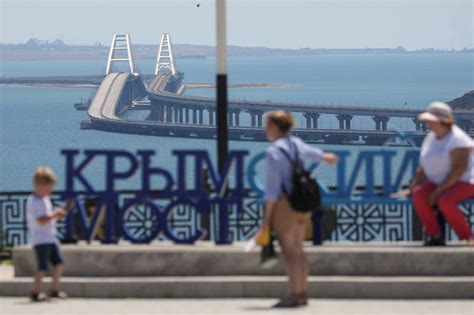 Russia targets Ukraine’s port of Odesa and calls it payback for a strike on a key bridge to Crimea