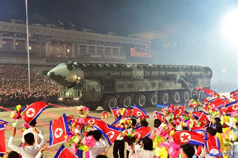 Russian and Chinese delegates join North Korean leader Kim at a parade showing his newest missiles