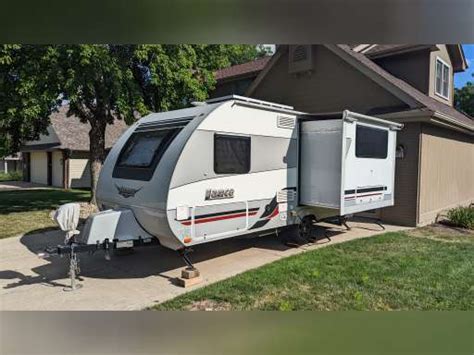 Used Travel Trailer in Fargo, North Dakota 68102. 2018 Winnebago Minnie Drop 1710 18' 4" Travel Trailer. Awning, Sleeps 4, A/C Unit.This retro Winnie Drop 1710 teardrop trailer by Winnebago is super light and ready to go! Featuring a front booth dinette with a slide-n-seat for seating, dining, and even ad ... National Vehicle.. 