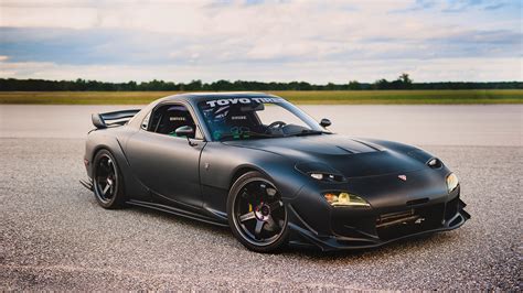 It has a finely tuned 13B rotary engine, masterfully tweaked by VeilSide. What sets it apart is the addition of an HKS turbocharger, which catapults its power output and overall performance to new heights. To put it in perspective, the stock 1997 RX-7 FD delivered a respectable 255 horsepower and 217 lb-ft of torque.. 