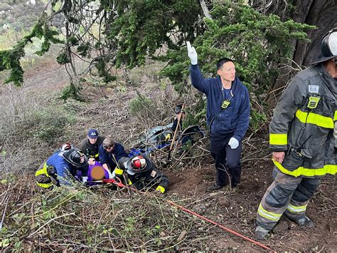 SFFD crews work to rescue 2 people from car that fell 100 feet
