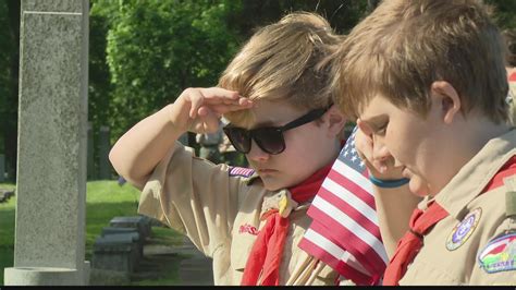 STL Boy Scouts placing flags for Memorial Day 'good turn' today