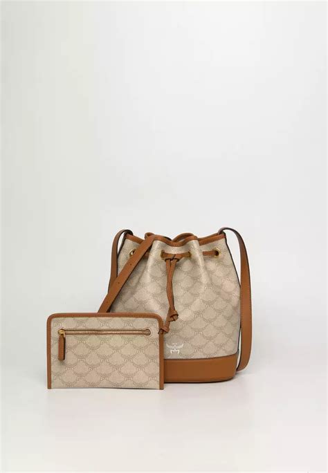 Style Edit: MCM marks 50 years by reinventing its iconic bags for an ... - balustradellc