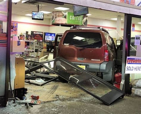 SUV crashes into 7-Eleven store in Aurora where fatally shot man is found by vehicle