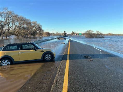 Sacramento flood updates: Highway 99 closed, levee topped