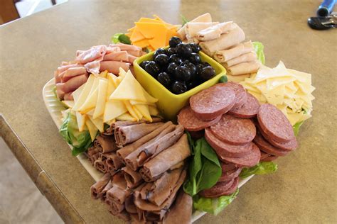 Safeway deli platters. Jan 10, 2019 · Artisan Roll Platter This platter has an assortment of white, 60%, 100% whole grain and multigrain rolls that are fresh baked each morning. large tray (25 guests) $4.99: Dessert Platter A delightful assortment of squares, cookies and pastries. The platters range in size from 12" (small), 16" (medium), and 18" (large). small tray (20 guests) $12.99 