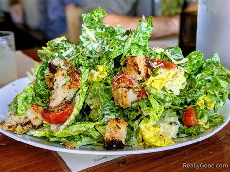 Salad restaurants. The lacinato kale and sea vegetable salad is full of flavor with spiced almonds, cucumber, kimchi, a macadamia “cheese” kale crisp, and teriyaki dressing. If salad cravings are still present ... 