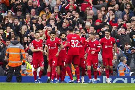Salah scores twice as Liverpool beats 10-man Everton 2-0 in Merseyside derby in Premier League