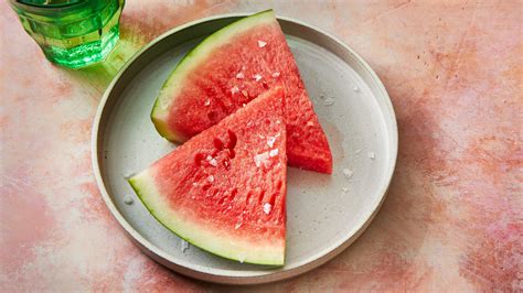 Salt on watermelon. Putting salt on watermelon or eating it with a spoon - never seen, would frame you as a lunatic and a waster of perfectly good watermelon. Just cut a piece for you and share the rest with the others. For regular melons, eating it with ham is nice. 