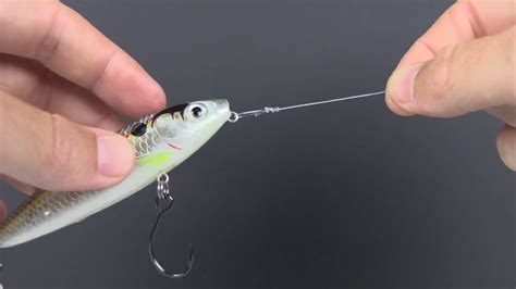 Improved Clinch Knot In 30 Seconds [VIDEO] First, feed the end of the line through the eye of your hook or jighead. Then with the tag end, wrap 4-5 turns around the main line. Once you complete the wraps, put the tag end through the initial loop that you created above the eye of the hook or jighead. Then, take the tag end and pull it back .... 