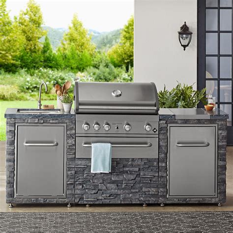 The Ideal Outdoor Kitchen With ample space for prepping steaks, burgers, fresh veggies, and more, the weather-resistant, sintered stone countertop offers heat and stain resistance. For extra convenience, this gas grill island features a drawer for keeping buns and other food items warm.. 